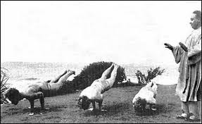 Teaching peacock posture, one of the original 84 asanas.